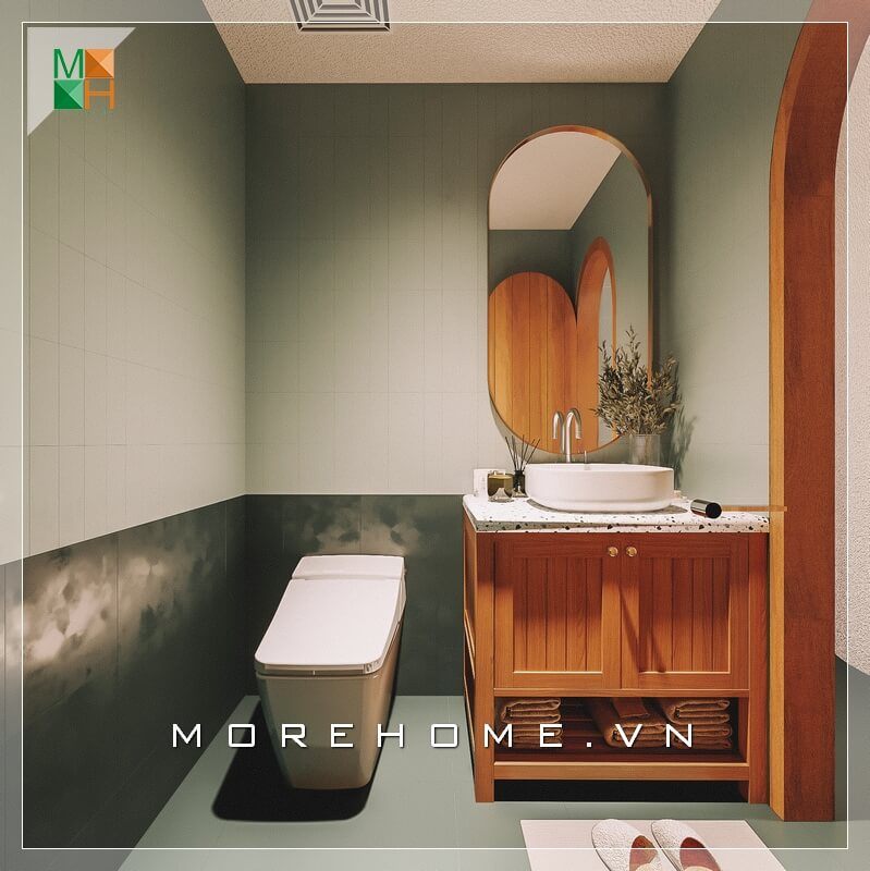 . Thiết kế nhà vệ sinh có diện tích nhỏ với sự kết hợp giữa màu nâu của gỗ và màu xanh rêu phá cách của tường và sàn, khiến cho không gian chật hẹp trở nên mát mắt hơn.